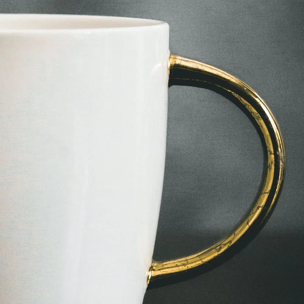 Stoneware mug with gold-glazed handle, detail